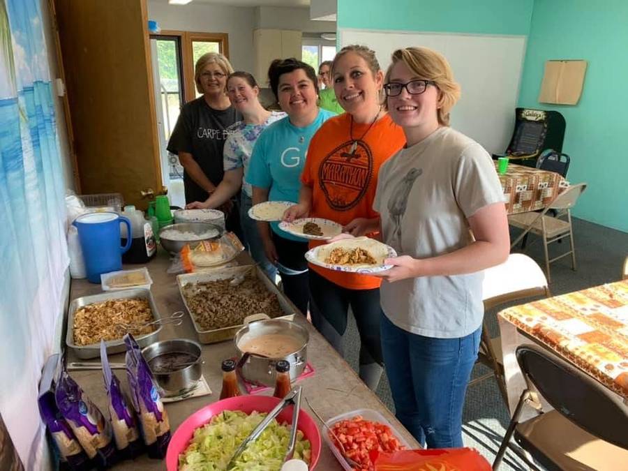 Kitchen team serving a meal