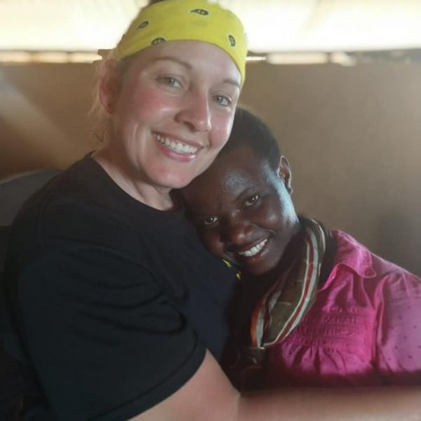 Sunshine with girl in Uganda